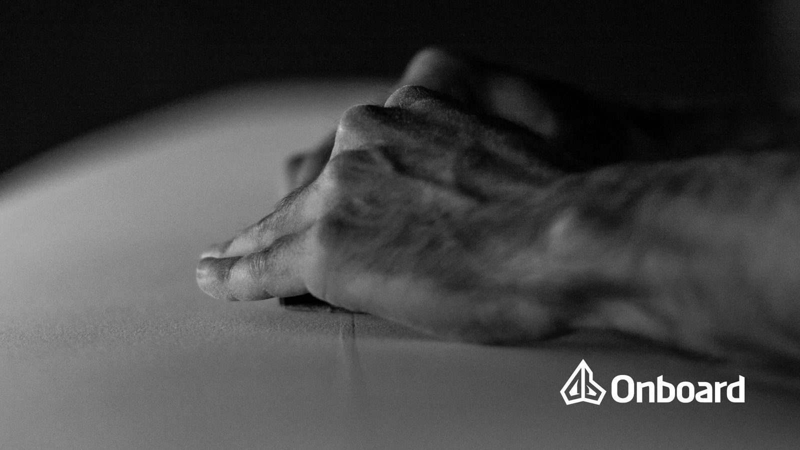 shaper shapping a surfboard