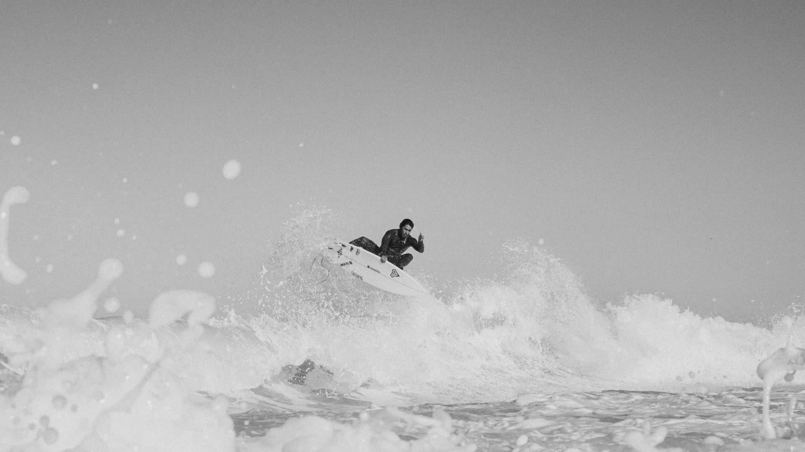 surfer doing an air with an Onboard 